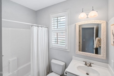 Nestled on a quiet tree-lined street, this custom-built home on Members Club At St. James Plantation in North Carolina - for sale on GolfHomes.com, golf home, golf lot