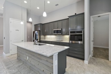 Live the resort lifestyle at 336 Stirling Bridge Drive, nestled on Plantation Bay Golf and Country Club in Florida - for sale on GolfHomes.com, golf home, golf lot