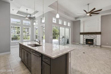 Live the resort lifestyle at 336 Stirling Bridge Drive, nestled on Plantation Bay Golf and Country Club in Florida - for sale on GolfHomes.com, golf home, golf lot