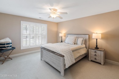Nestled on a quiet tree-lined street, this custom-built home on Members Club At St. James Plantation in North Carolina - for sale on GolfHomes.com, golf home, golf lot