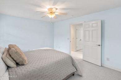 Nestled on a quiet tree-lined street, this custom-built home on Members Club At St. James Plantation in North Carolina - for sale on GolfHomes.com, golf home, golf lot