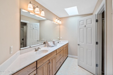 Nestled on a quiet tree-lined street, this custom-built home on Members Club At St. James Plantation in North Carolina - for sale on GolfHomes.com, golf home, golf lot
