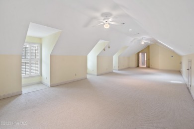 Nestled on a quiet tree-lined street, this custom-built home on Members Club At St. James Plantation in North Carolina - for sale on GolfHomes.com, golf home, golf lot