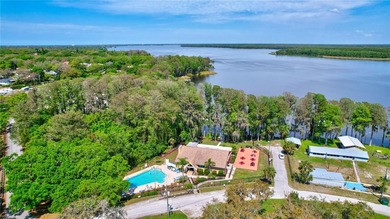 Welcome to this beautifully updated two-bedroom villa in highly on Highland Lakes Executive Golf Course in Florida - for sale on GolfHomes.com, golf home, golf lot