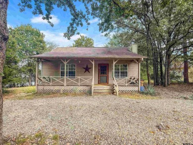 Nestled among the towering pines of East Texas, this beautifully on Holly Lake Ranch Golf Club in Texas - for sale on GolfHomes.com, golf home, golf lot