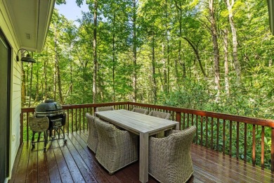 This beautiful, updated home located in Sapphire Valley sits on on Sapphire National Golf Club in North Carolina - for sale on GolfHomes.com, golf home, golf lot