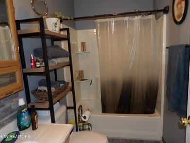 Well-maintained property featuring a 14' RV carport with hookups on Lake Tansi Village Country Club in Tennessee - for sale on GolfHomes.com, golf home, golf lot