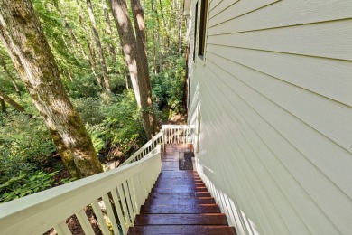 This beautiful, updated home located in Sapphire Valley sits on on Sapphire National Golf Club in North Carolina - for sale on GolfHomes.com, golf home, golf lot