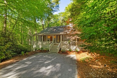 This beautiful, updated home located in Sapphire Valley sits on on Sapphire National Golf Club in North Carolina - for sale on GolfHomes.com, golf home, golf lot