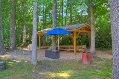 This beautiful, updated home located in Sapphire Valley sits on on Sapphire National Golf Club in North Carolina - for sale on GolfHomes.com, golf home, golf lot