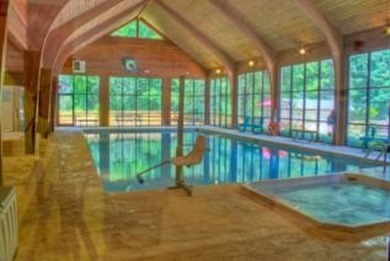 This beautiful, updated home located in Sapphire Valley sits on on Sapphire National Golf Club in North Carolina - for sale on GolfHomes.com, golf home, golf lot