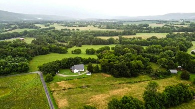 Nestled on 10.74 acres, this charming 1900s farmhouse offers on  in Tennessee - for sale on GolfHomes.com, golf home, golf lot
