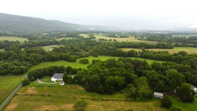 Nestled on 10.74 acres, this charming 1900s farmhouse offers on  in Tennessee - for sale on GolfHomes.com, golf home, golf lot