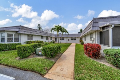 Enjoy serene water views from this fully remodeled ground-floor on Kings Point Golf - Executive in Florida - for sale on GolfHomes.com, golf home, golf lot