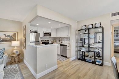 Enjoy serene water views from this fully remodeled ground-floor on Kings Point Golf - Executive in Florida - for sale on GolfHomes.com, golf home, golf lot