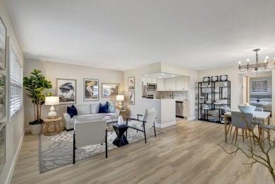 Enjoy serene water views from this fully remodeled ground-floor on Kings Point Golf - Executive in Florida - for sale on GolfHomes.com, golf home, golf lot