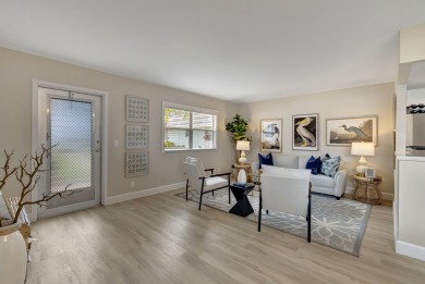 Enjoy serene water views from this fully remodeled ground-floor on Kings Point Golf - Executive in Florida - for sale on GolfHomes.com, golf home, golf lot