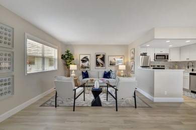 Enjoy serene water views from this fully remodeled ground-floor on Kings Point Golf - Executive in Florida - for sale on GolfHomes.com, golf home, golf lot