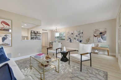Enjoy serene water views from this fully remodeled ground-floor on Kings Point Golf - Executive in Florida - for sale on GolfHomes.com, golf home, golf lot