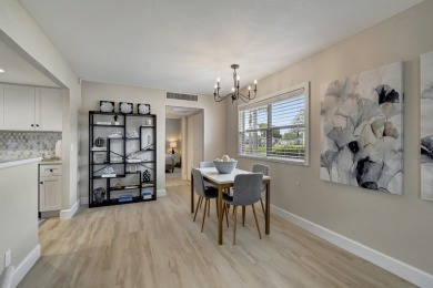 Enjoy serene water views from this fully remodeled ground-floor on Kings Point Golf - Executive in Florida - for sale on GolfHomes.com, golf home, golf lot
