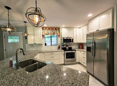 Beautifully updated 3 bed/3 bath cabin in Hide-A-Way Hills on Hide-A-Way Hills Golf Club in Ohio - for sale on GolfHomes.com, golf home, golf lot