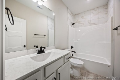 Discover your dream home where elegance meets functionality in a on Deercroft Golf and Country Club in North Carolina - for sale on GolfHomes.com, golf home, golf lot