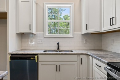 Discover your dream home where elegance meets functionality in a on Deercroft Golf and Country Club in North Carolina - for sale on GolfHomes.com, golf home, golf lot