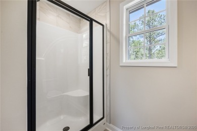 Discover your dream home where elegance meets functionality in a on Deercroft Golf and Country Club in North Carolina - for sale on GolfHomes.com, golf home, golf lot