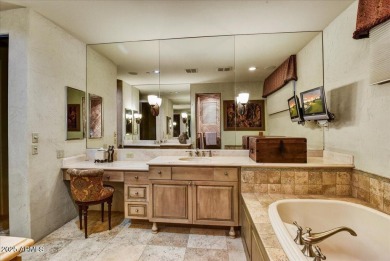Experience luxury and ease in this rare semi-custom villa on Superstition Mountain Club - Lost Gold in Arizona - for sale on GolfHomes.com, golf home, golf lot