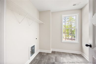 Discover your dream home where elegance meets functionality in a on Deercroft Golf and Country Club in North Carolina - for sale on GolfHomes.com, golf home, golf lot