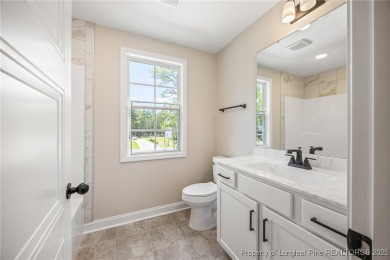 Discover your dream home where elegance meets functionality in a on Deercroft Golf and Country Club in North Carolina - for sale on GolfHomes.com, golf home, golf lot