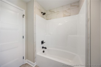 Discover your dream home where elegance meets functionality in a on Deercroft Golf and Country Club in North Carolina - for sale on GolfHomes.com, golf home, golf lot
