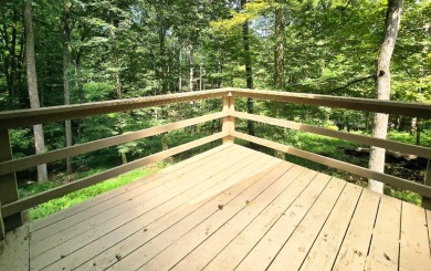 Beautifully updated 3 bed/3 bath cabin in Hide-A-Way Hills on Hide-A-Way Hills Golf Club in Ohio - for sale on GolfHomes.com, golf home, golf lot