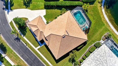Savor endless, golden sunsets across the wide lake from this on Shell Point Golf Club in Florida - for sale on GolfHomes.com, golf home, golf lot