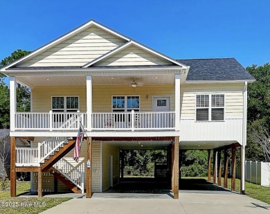 Welcome to 109 SW 17th Street, a beautiful home on pilings with on Founders Club At St. James Plantation in North Carolina - for sale on GolfHomes.com, golf home, golf lot