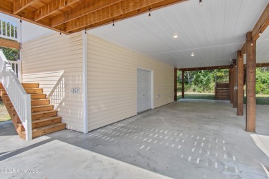 Welcome to 109 SW 17th Street, a beautiful home on pilings with on Founders Club At St. James Plantation in North Carolina - for sale on GolfHomes.com, golf home, golf lot