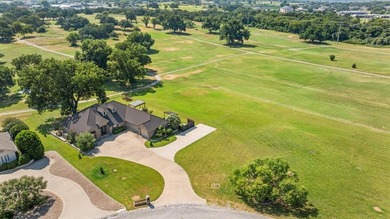 Inspiring elegance and golf course views combine in this move-in on Granbury Country Club in Texas - for sale on GolfHomes.com, golf home, golf lot