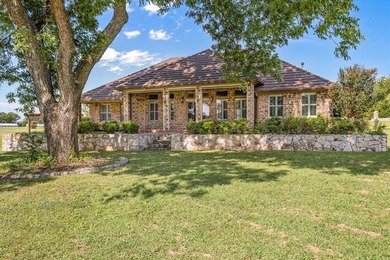 Inspiring elegance and golf course views combine in this move-in on Granbury Country Club in Texas - for sale on GolfHomes.com, golf home, golf lot