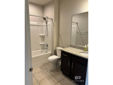 This newly updated, 4 bed/2 bath gold fortified house sits on on The Golf Club of the Wharf in Alabama - for sale on GolfHomes.com, golf home, golf lot