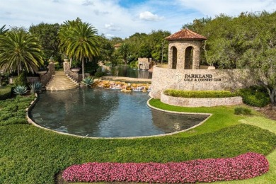 Behind a breathtaking guard-gated entrance, manicured on Parkland Golf Club in Florida - for sale on GolfHomes.com, golf home, golf lot