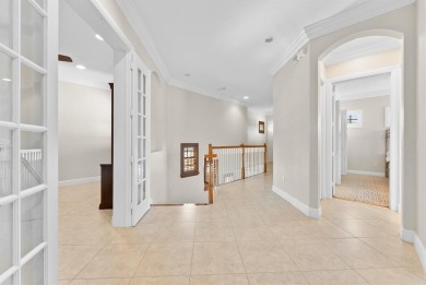 Behind a breathtaking guard-gated entrance, manicured on Parkland Golf Club in Florida - for sale on GolfHomes.com, golf home, golf lot