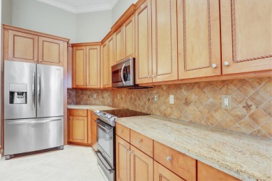 SPECTACULAR GOLF & WATER VIEWS! Nestled within the prestigious on The Legacy Golf and Tennis Club in Florida - for sale on GolfHomes.com, golf home, golf lot