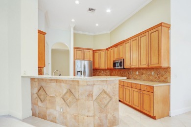 SPECTACULAR GOLF & WATER VIEWS! Nestled within the prestigious on The Legacy Golf and Tennis Club in Florida - for sale on GolfHomes.com, golf home, golf lot