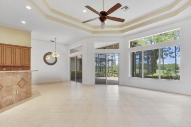 SPECTACULAR GOLF & WATER VIEWS! Nestled within the prestigious on The Legacy Golf and Tennis Club in Florida - for sale on GolfHomes.com, golf home, golf lot