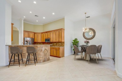 SPECTACULAR GOLF & WATER VIEWS! Nestled within the prestigious on The Legacy Golf and Tennis Club in Florida - for sale on GolfHomes.com, golf home, golf lot