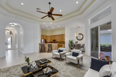 SPECTACULAR GOLF & WATER VIEWS! Nestled within the prestigious on The Legacy Golf and Tennis Club in Florida - for sale on GolfHomes.com, golf home, golf lot