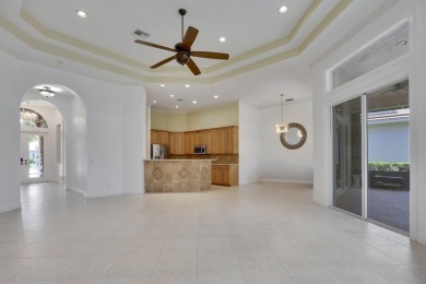 SPECTACULAR GOLF & WATER VIEWS! Nestled within the prestigious on The Legacy Golf and Tennis Club in Florida - for sale on GolfHomes.com, golf home, golf lot