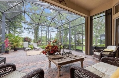 SPECTACULAR GOLF & WATER VIEWS! Nestled within the prestigious on The Legacy Golf and Tennis Club in Florida - for sale on GolfHomes.com, golf home, golf lot