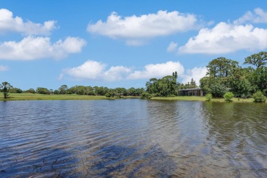SPECTACULAR GOLF & WATER VIEWS! Nestled within the prestigious on The Legacy Golf and Tennis Club in Florida - for sale on GolfHomes.com, golf home, golf lot