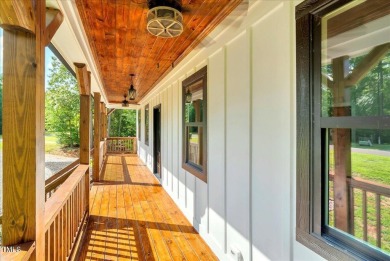 Welcome to this stunning brand new Kerr Lake home in the gated on Kerr Lake Country Club in North Carolina - for sale on GolfHomes.com, golf home, golf lot